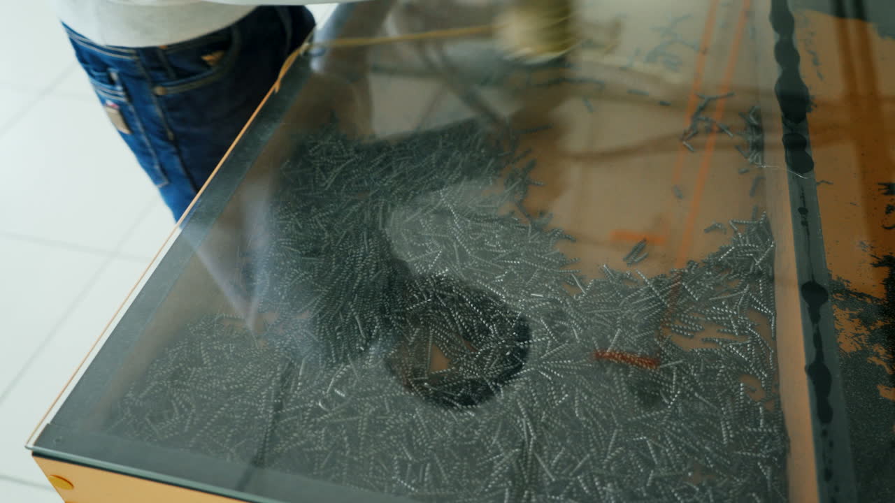 Iron filings in a magnetic field. Boy conducts research experience.