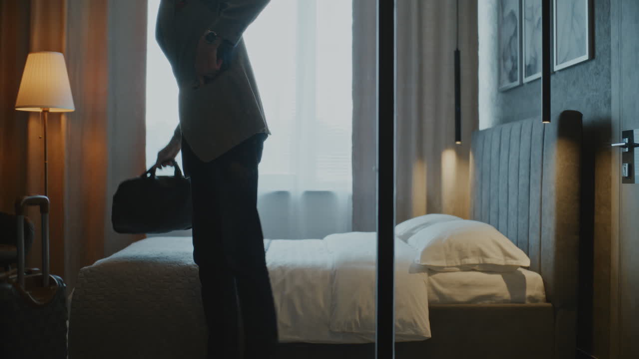 Elegant Mature Man With Gray Hair Enters Modern Hotel Room (Stock Footage)
