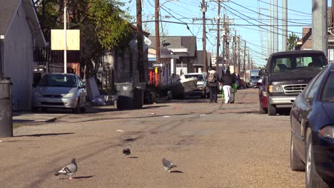 people walk on the street in an african american neighborhood in new orleans louisiana