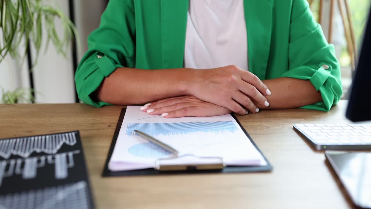 Professional Handshake Across an Office Desk