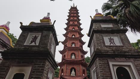 tourists walking by an ancient pagoda structure