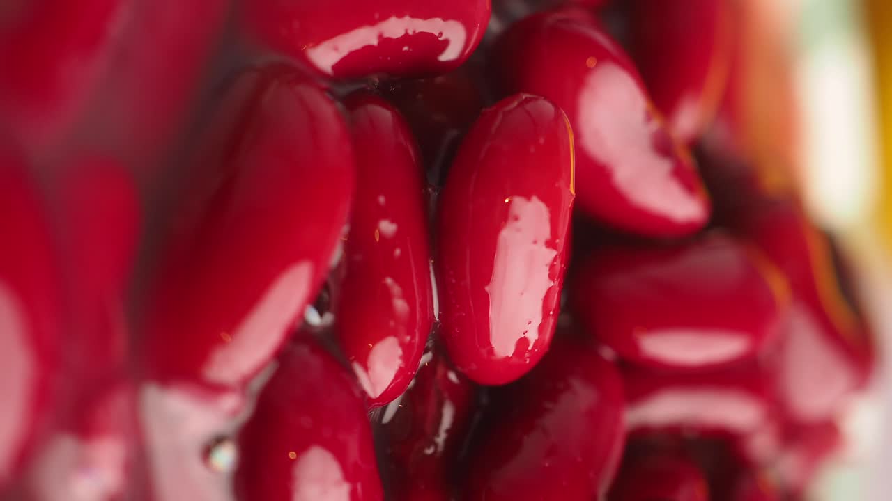 Close-up Macro Shot of Shiny Red Kidney Beans in Liquid