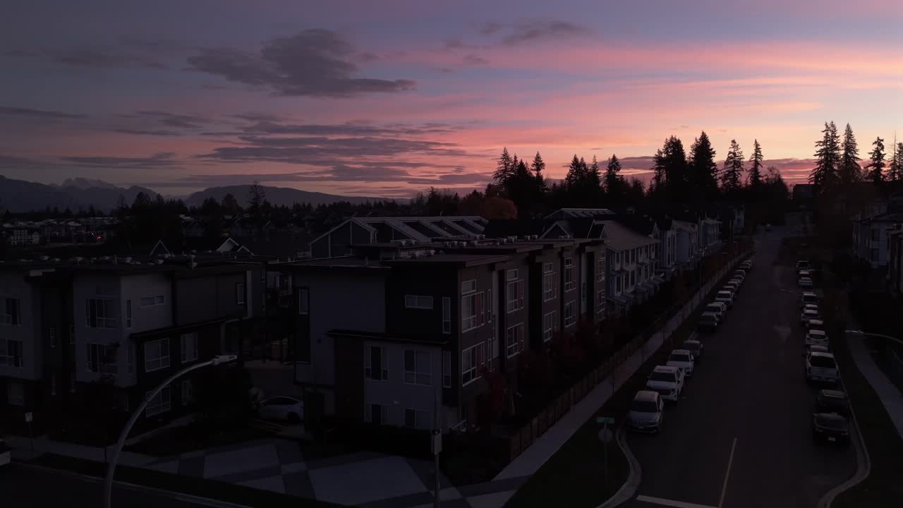 Beautiful Pink Sunset Sky Above Urban Neighborhood - Aerial Pedestal