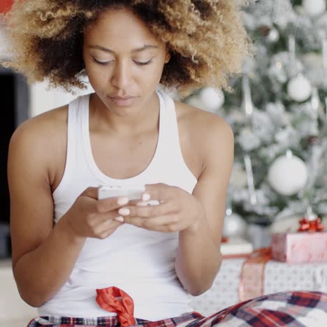 serious woman checking for christmas messages