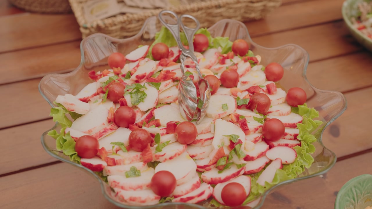 Fresh seafood salad with crab sticks and cherry tomatoes