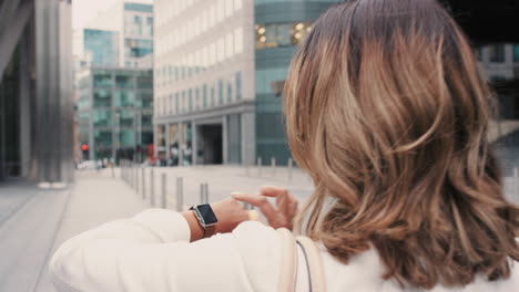 Beautiful-mixed-race-business-woman-walking-through-city