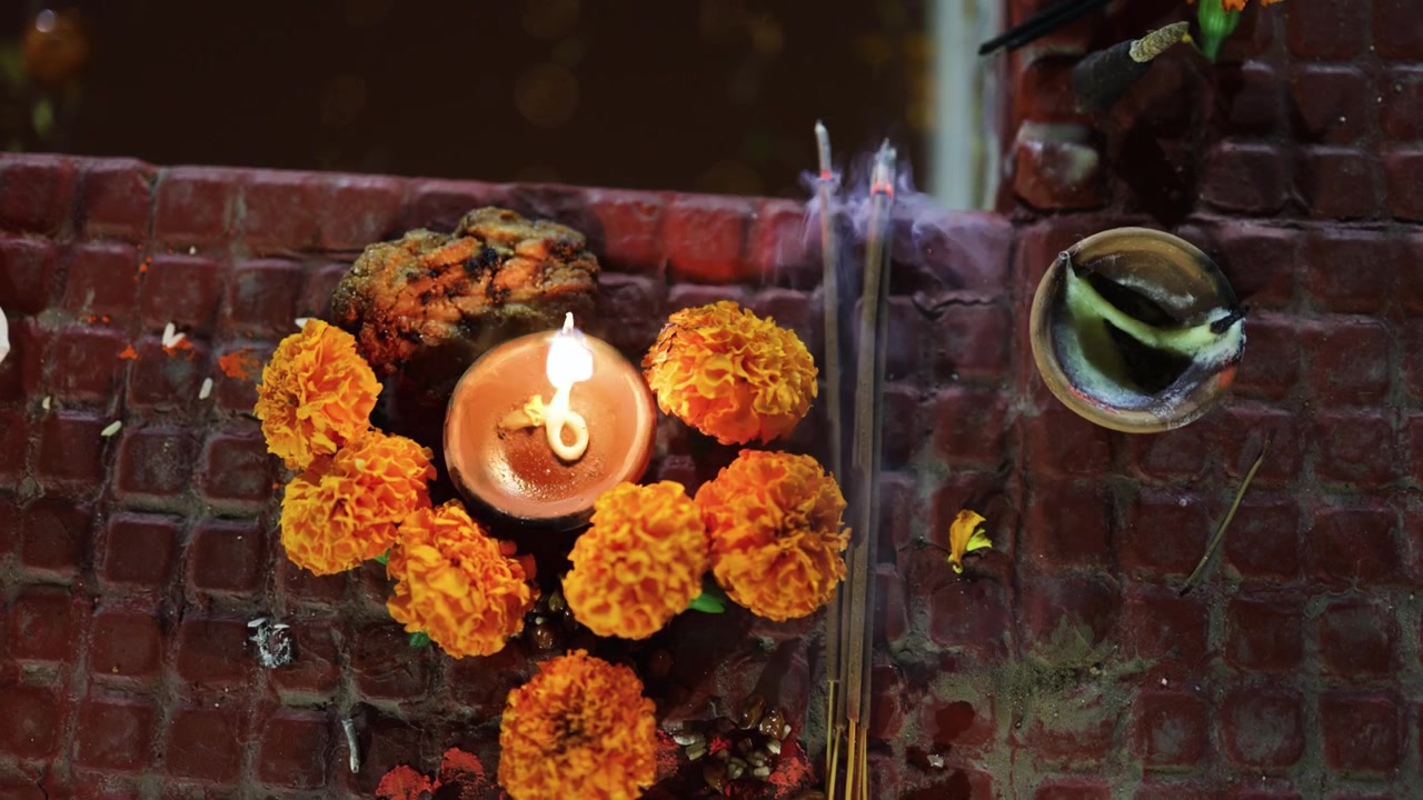 Glowing Clay Diya Surrounded by Marigold Flowers for Traditional Diwali chhath Celebration