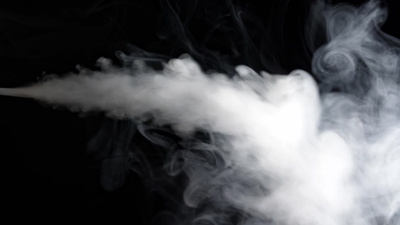 White Jet Of Vapour Steam Under Pressure On Black Background
