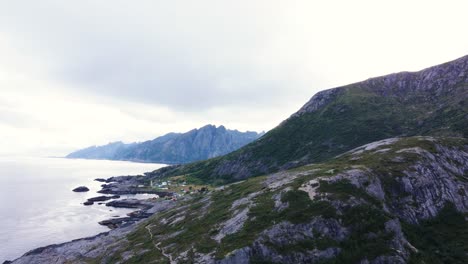 Flying-at-the-coast-of-Nesland-overlooking-the-ocean,-mountains-and-Nesland