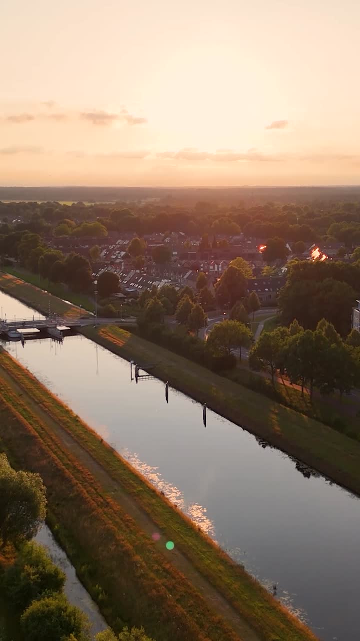 Aerial View of a Canal and Residential Area at Sunset