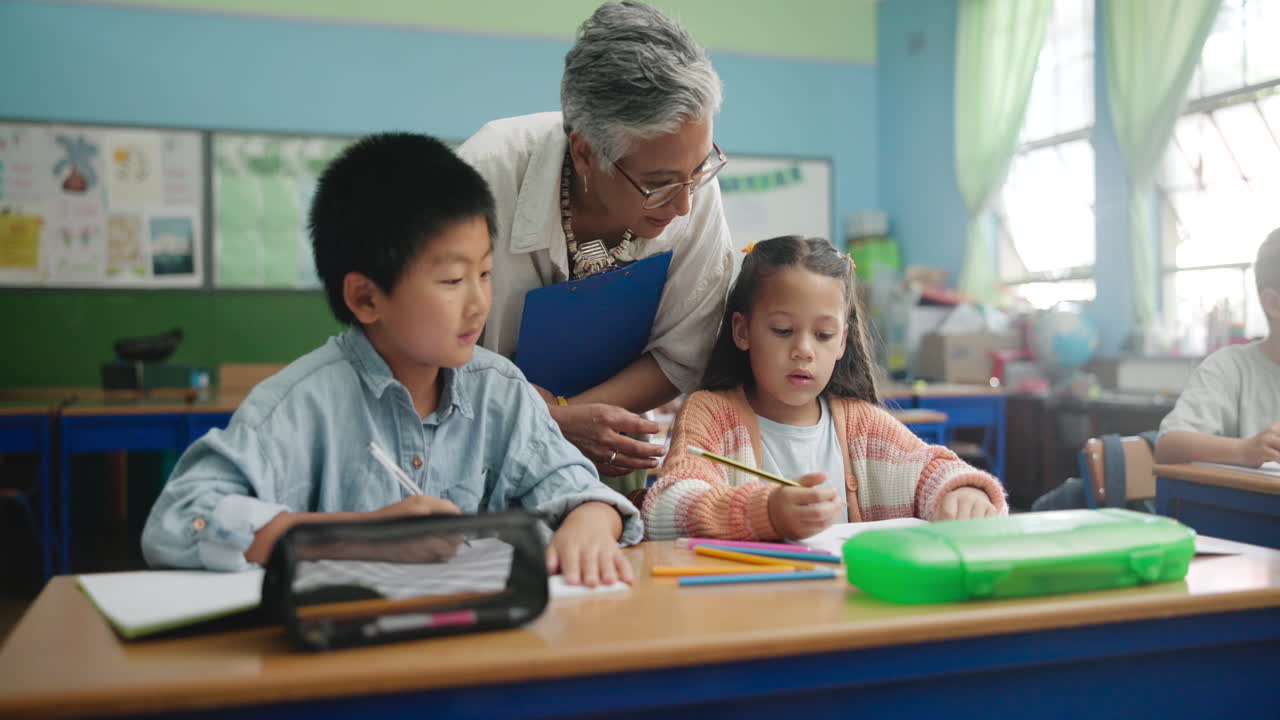 Teacher assisting students in a classroom
