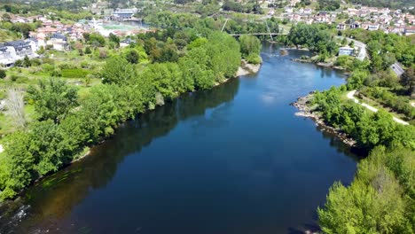 aerial of river flowing through a modern city