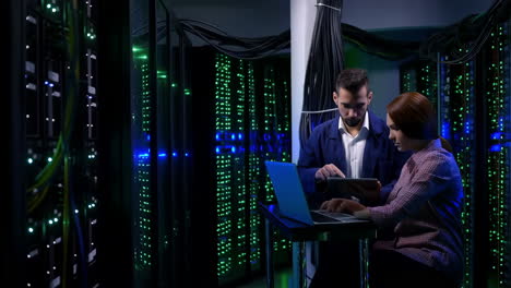 it professionals working in a server room