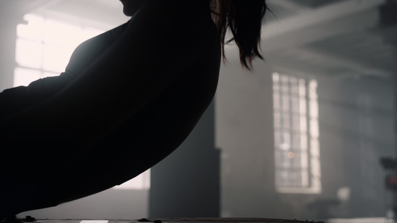 Woman doing abs exercises crunches. Bodybuilder making knee tuck crunches