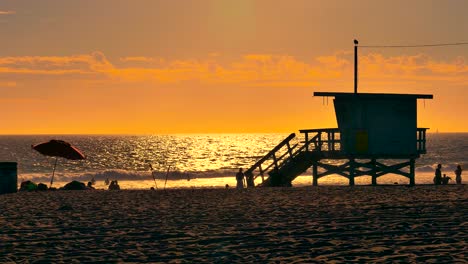 sunset beach scene with lifeguard tower