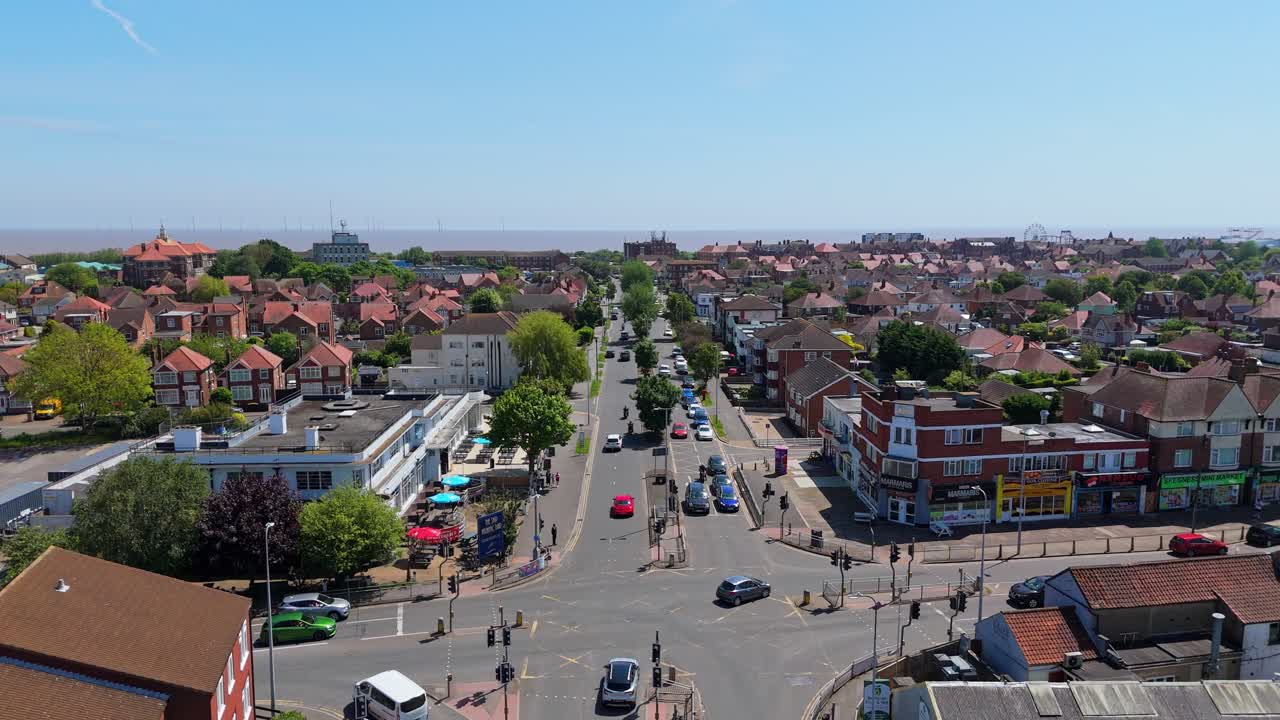 Aerial View of a Bustling Coastal Town Road Leading to the Sea