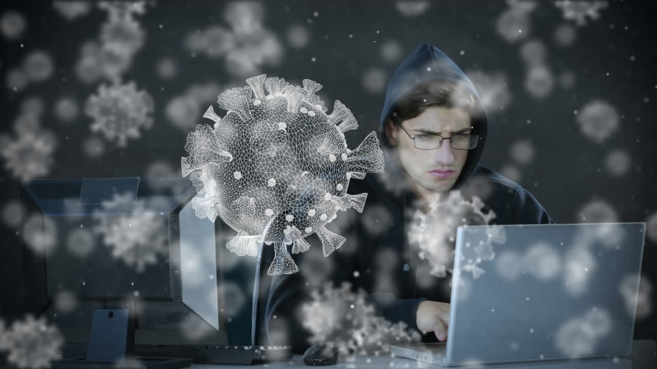 노트북을 사용하여 후디를 입은 남성에 대한 거대한 코로나19 세포의 애니메이션