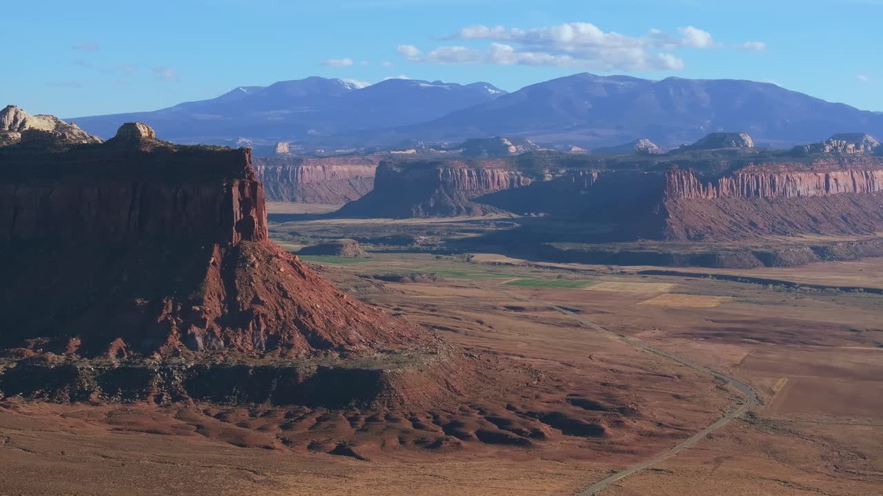 Scenic view of Moab's red rock formations under sunny blue skies