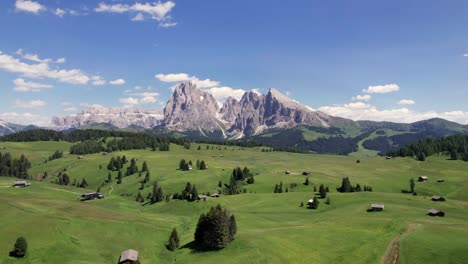 Aerial-panorama-of-Alpe-di-Siusi-alpine-plateau-with-Dolomites-mountain-background