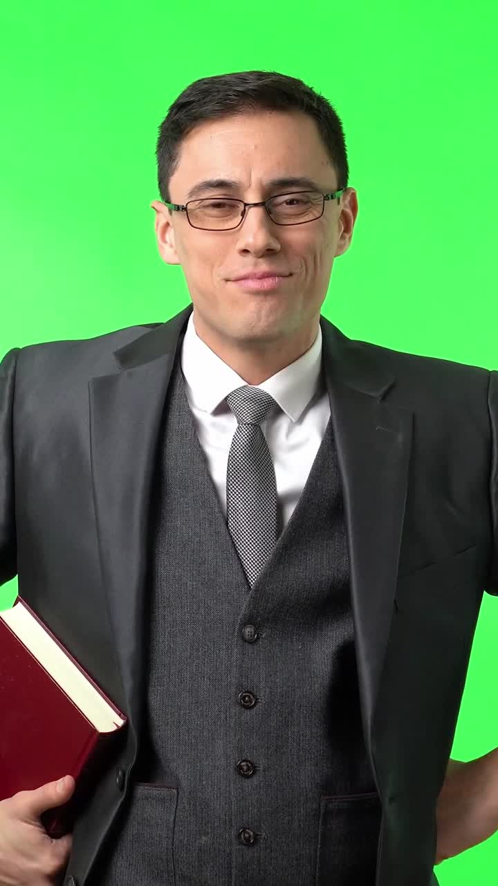Man in suit with book