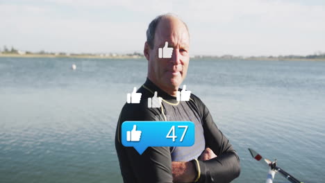 senior athlete standing lakeside in tech context displaying animated thumbs-up icons and like count