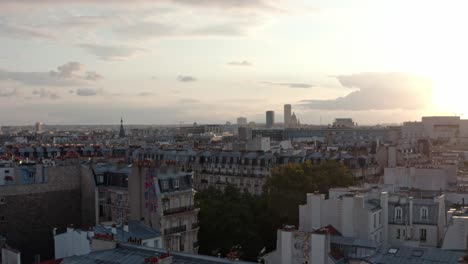 rising drone shot of eastern paris at sunset
