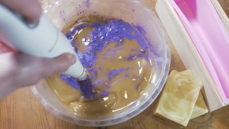 mixing colour powder into cold process soap