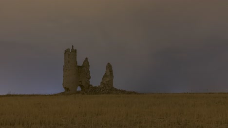 ruins of castle against stormy sky