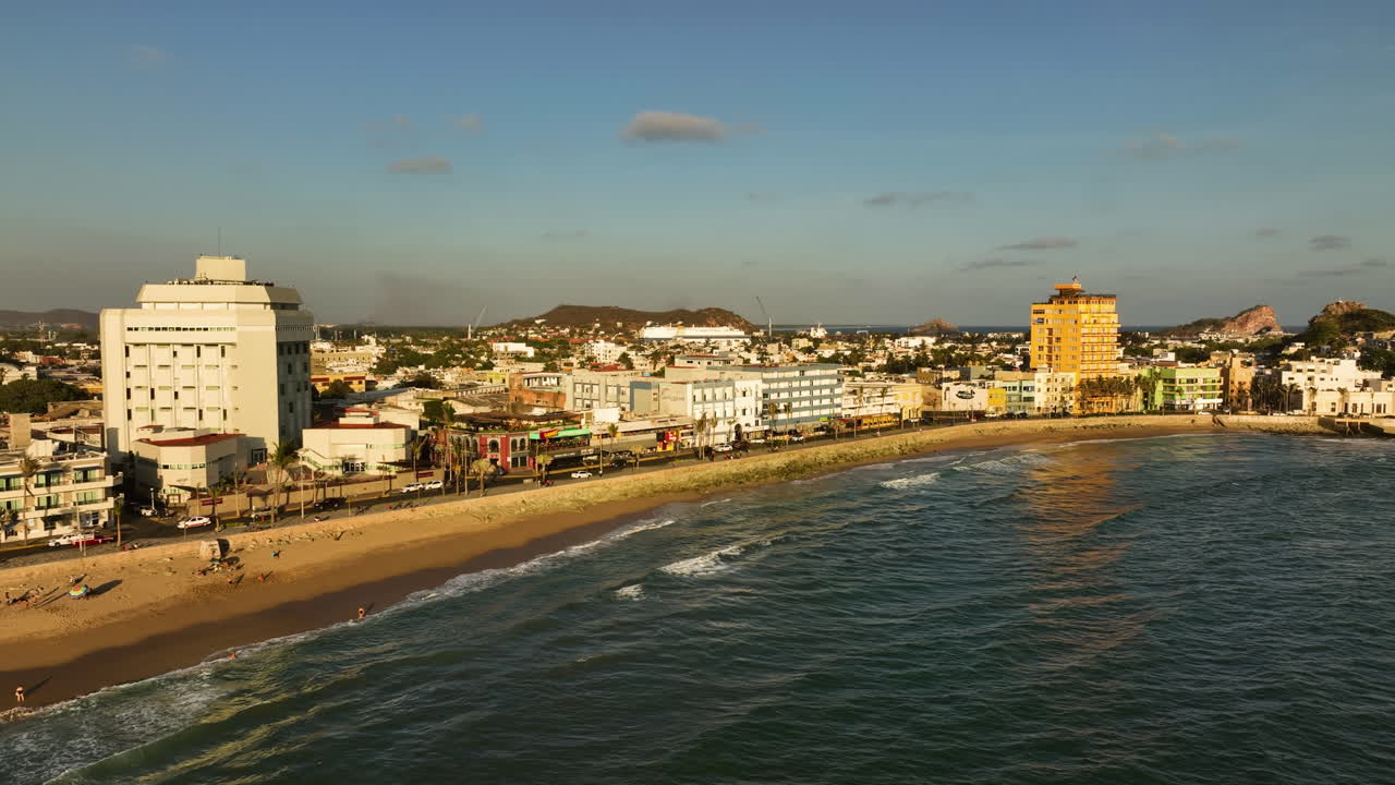 Aerial View of Coastal Town with Beach and Hotels