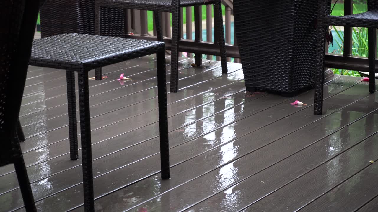 Light rainfall on a deck during a light summer storm