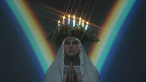 portrait of man with candle lit wreath on head