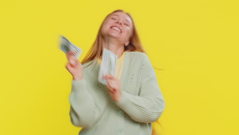 rich happy woman winner waving money dollar cash like a fan big income wealth success business