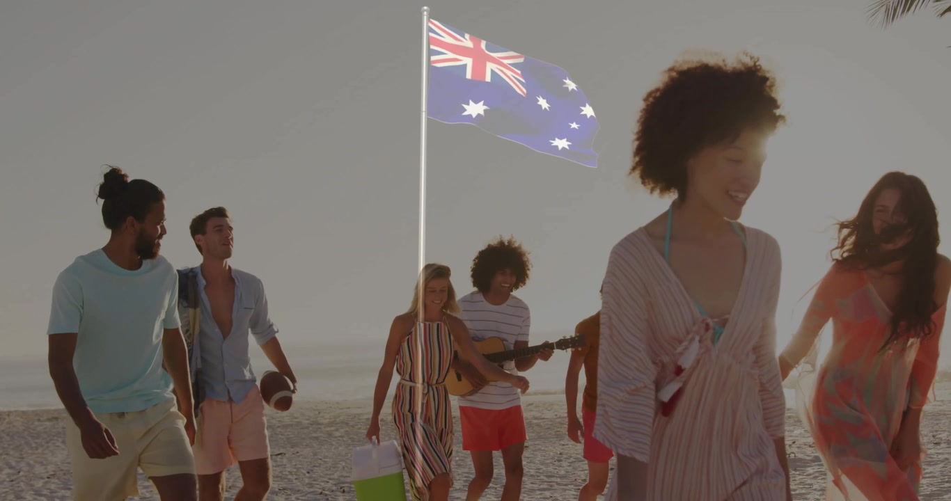 Friends at beach with Australian flag waving, creating animation in sand