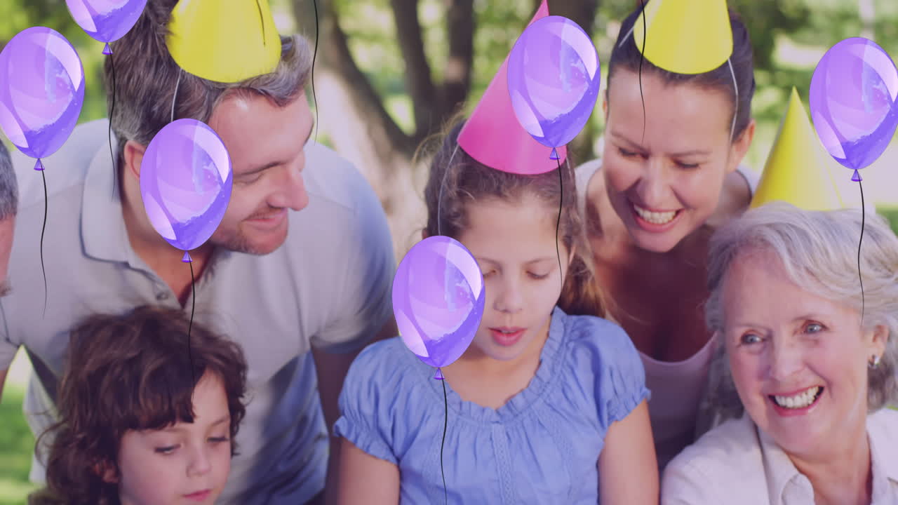 animación de globos sobre una familia caucásica en una fiesta de cumpleaños