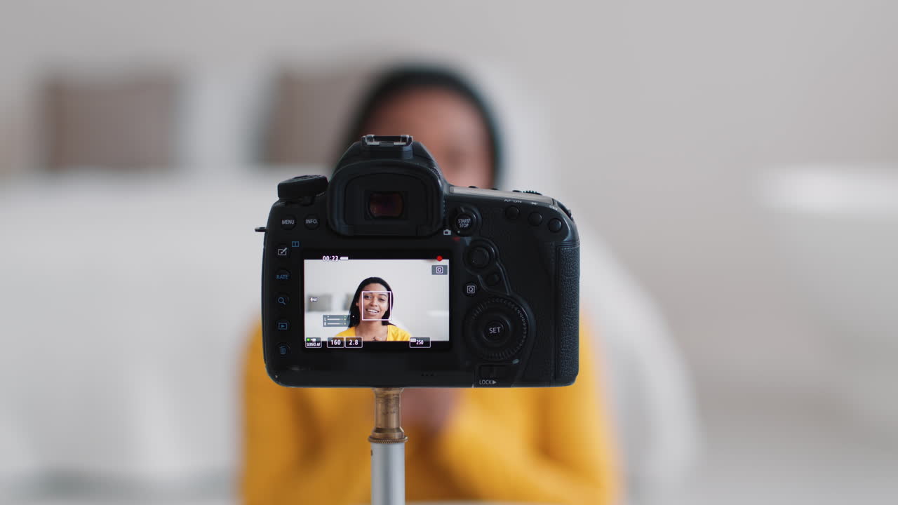 Woman Recording a Video Tutorial with DSLR Camera
