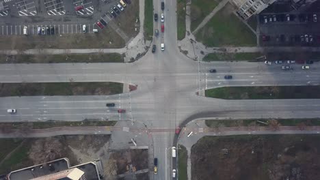 flying over a concrete living apartment area in east europa with many birds flying around the drone