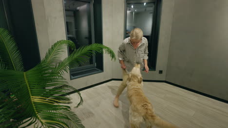 woman interacting with her golden retriever in a modern living room