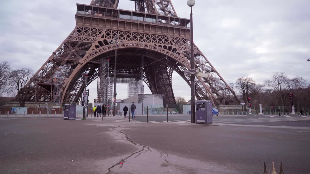 Scenery of the Eiffel Tower in Paris with a miniature golden version in the foreground, tourism in France
