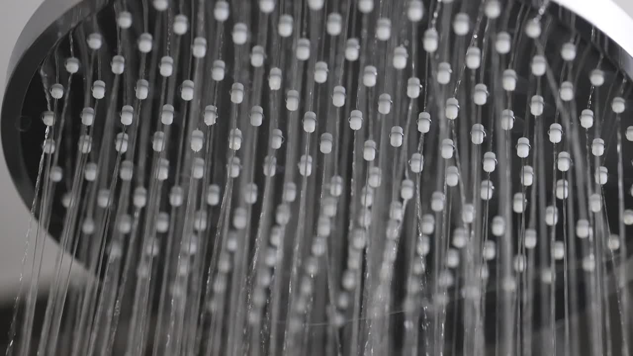 Close-up of Water Spraying from a Shower Head