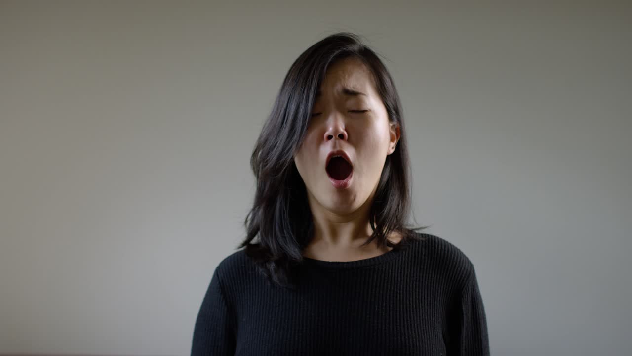 Asian Woman Sneezing With The Corona Virus