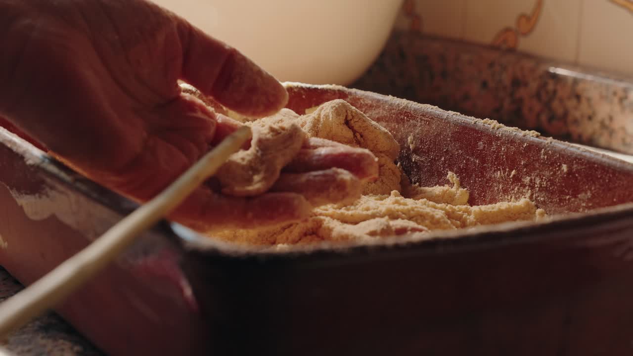 Pig tripe covered with cornmeal by hand in Minho north Portugal sausage tradition