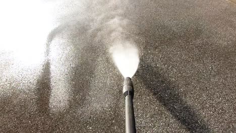 high-pressure water cleaner, slow motion, concrete dirt removal