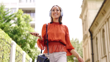 phone, music and woman dance in a city