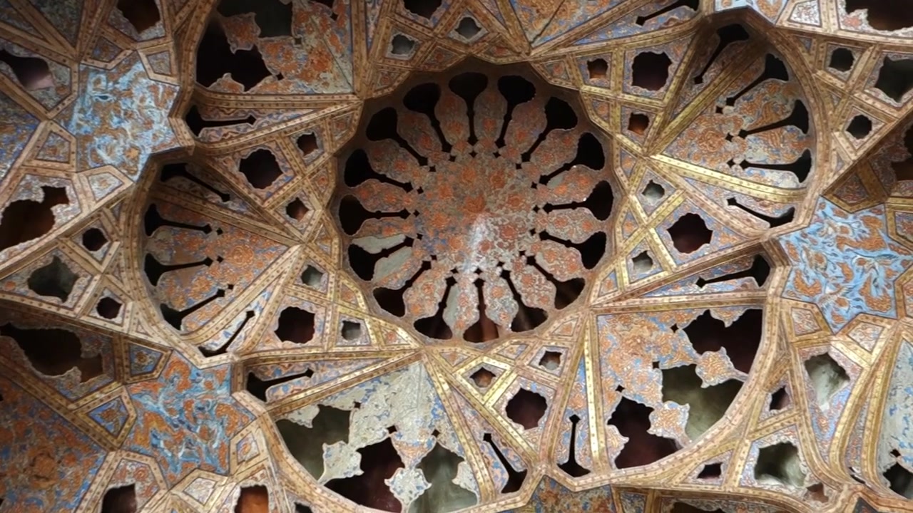 Oriental ornamented ceiling of the music hall room in Ali Qapu Palace, Isfahan, Iran.