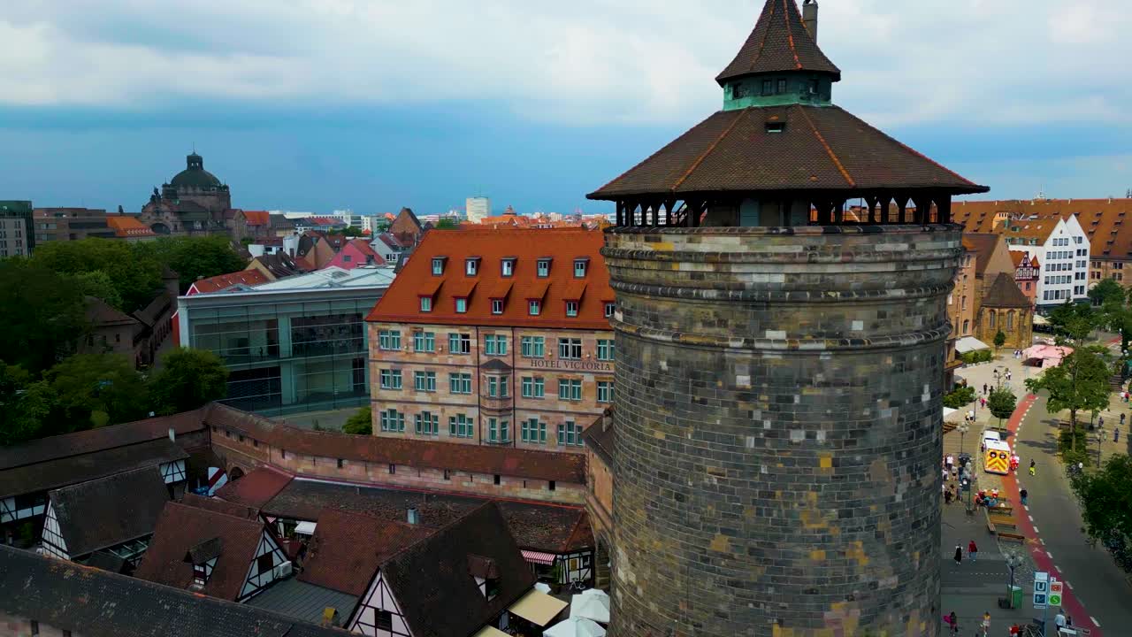 4K Aerial Drone Video of the Trains and Busses near the Ancient Women's Gate Tower in Downtown Nurnberg, Germany