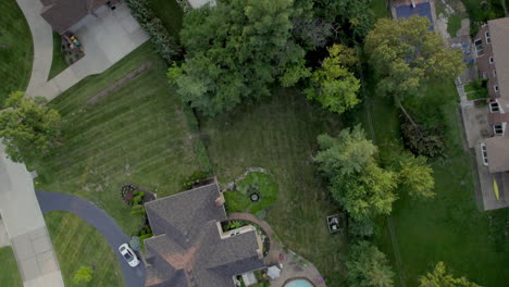 Top-down-aerial-scroll-over-beautiful-houses-in-nice-upscale-neighborhood-in-Town-and-Country-in-St