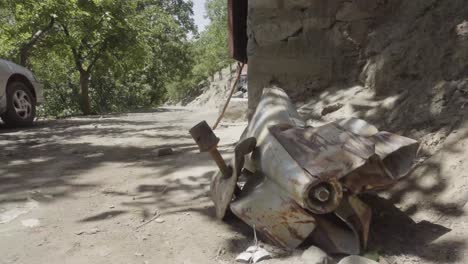 unexploded powerful rocket with hand grenade on side, pashir valley, afghanistan