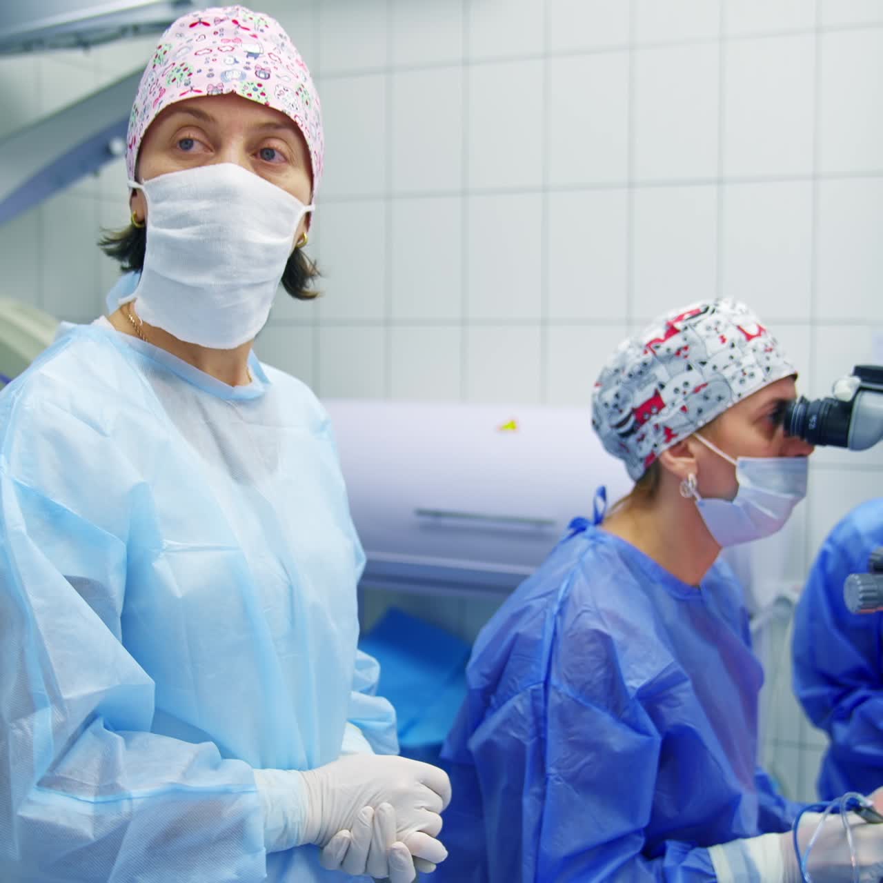 Ophthalmologists performing operation on eyes