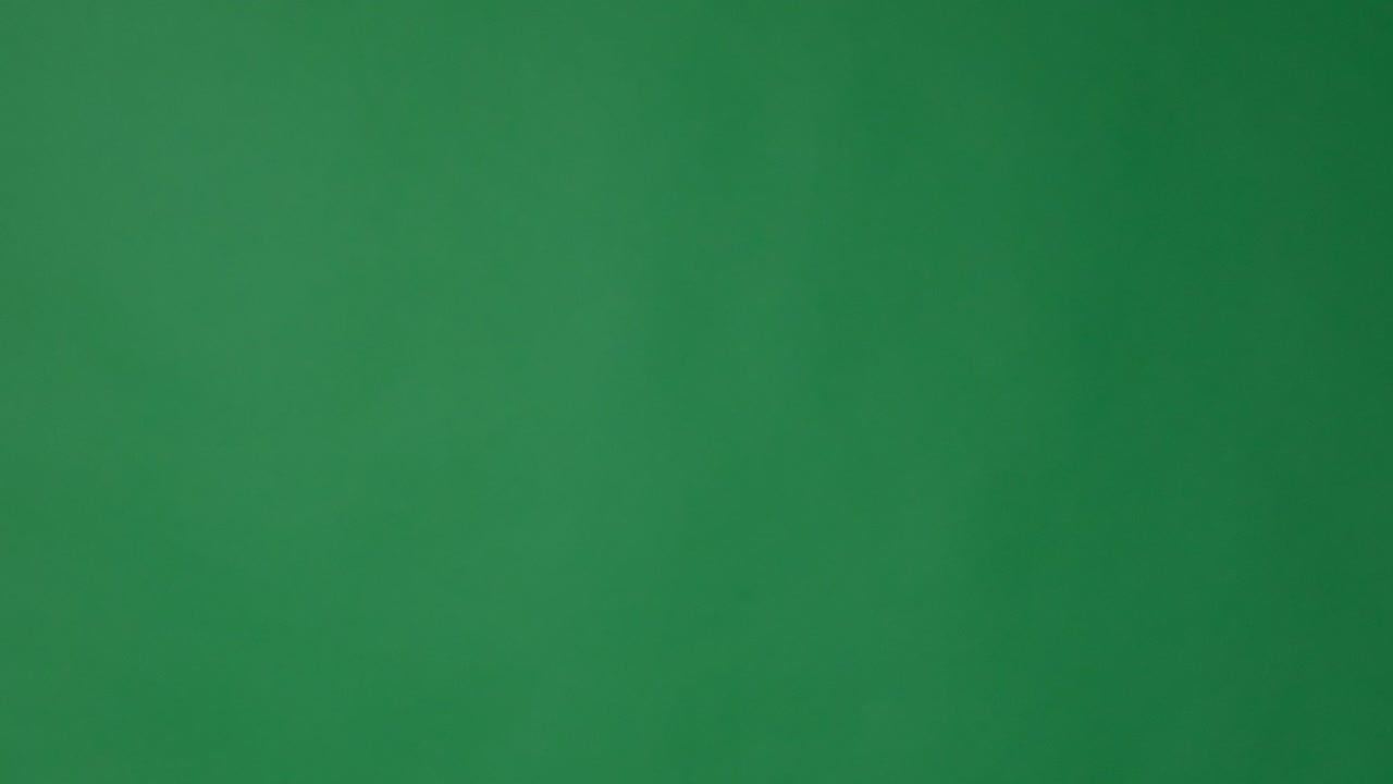 dedo de la mano apuntando sobre fondo verde