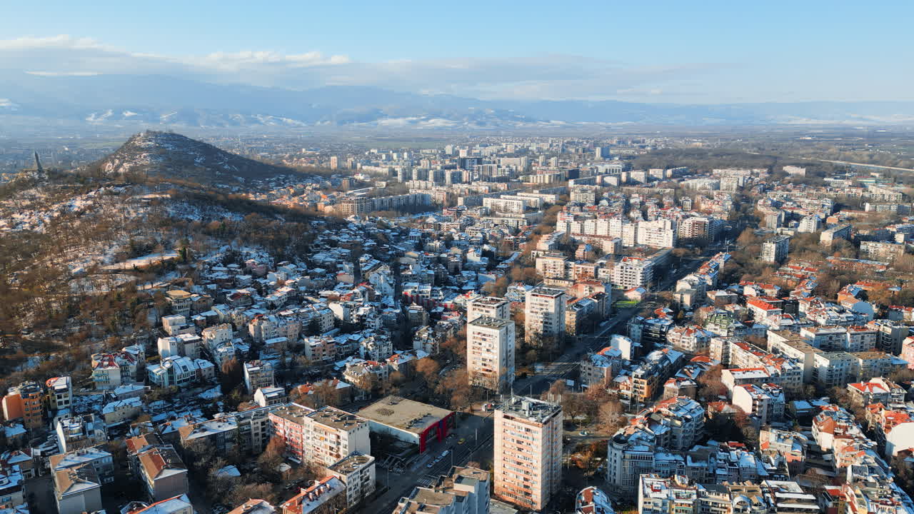 Aerial drone view of Plovdiv city covered in snow. The monument of the Red Army "Alyosha" on Bunarjik Hill. Bulgaria